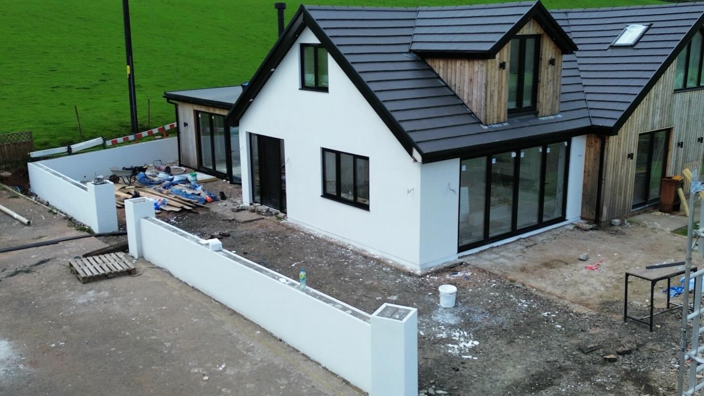 Rendered bungalow and garden walls from the corner