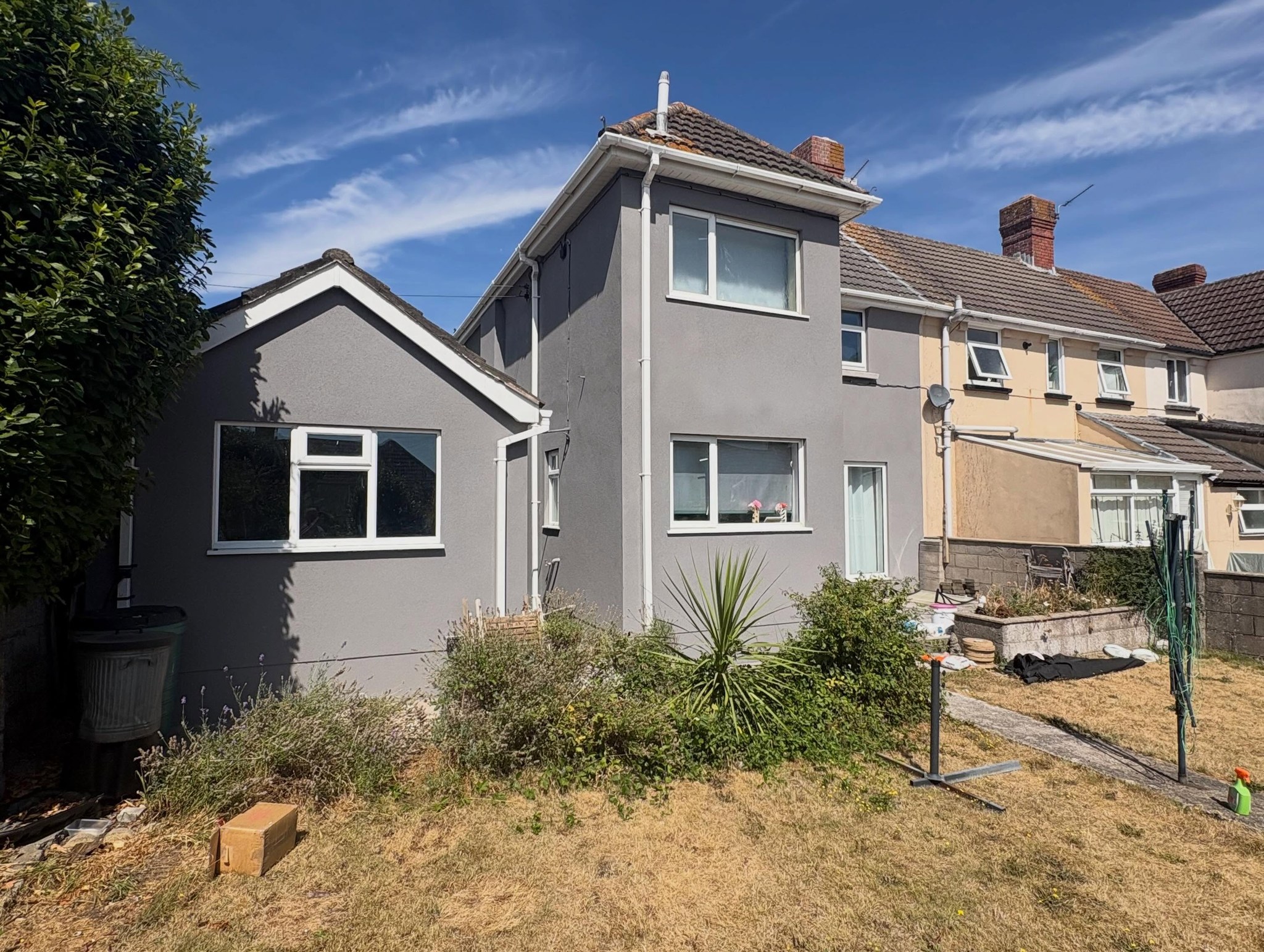 Rear of a semi-detached house in grey silicone render